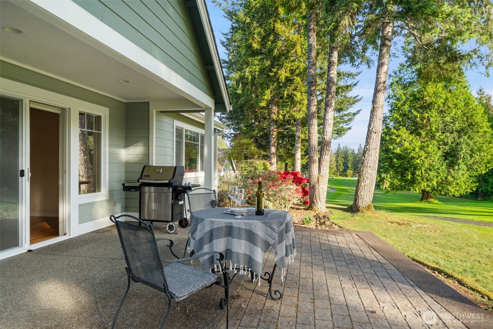 321 East Soderberg Road, Unit D12 Allyn, WA 98524 - Photo 10 of 37 a view of a house with backyard and sitting area