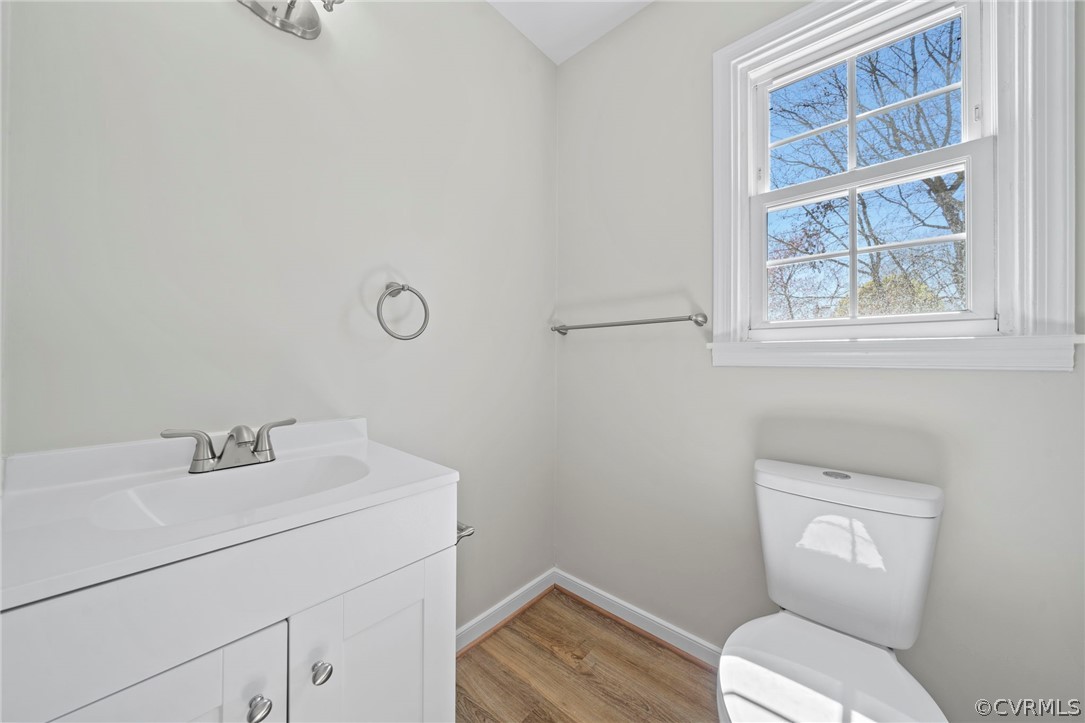 5205 Hallmark Circle Richmond, VA 23234 - Photo 20 of 36 a bathroom with a toilet sink and mirror