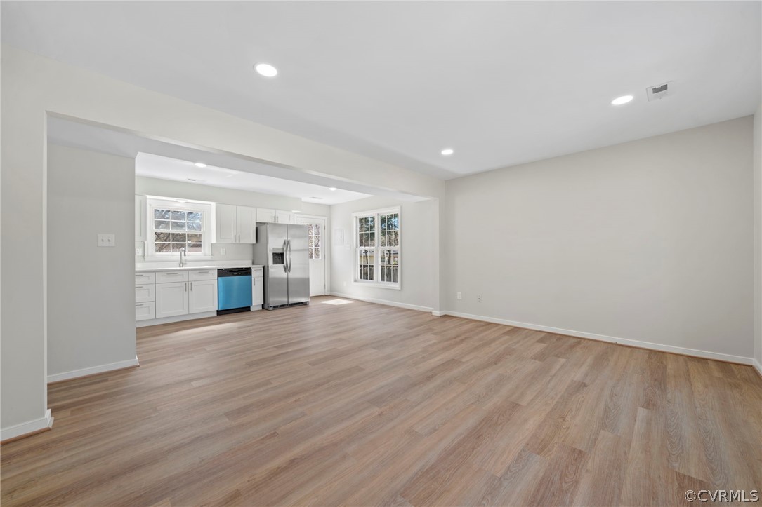 5205 Hallmark Circle Richmond, VA 23234 - Photo 3 of 36 wooden floor in an empty room with a kitchen