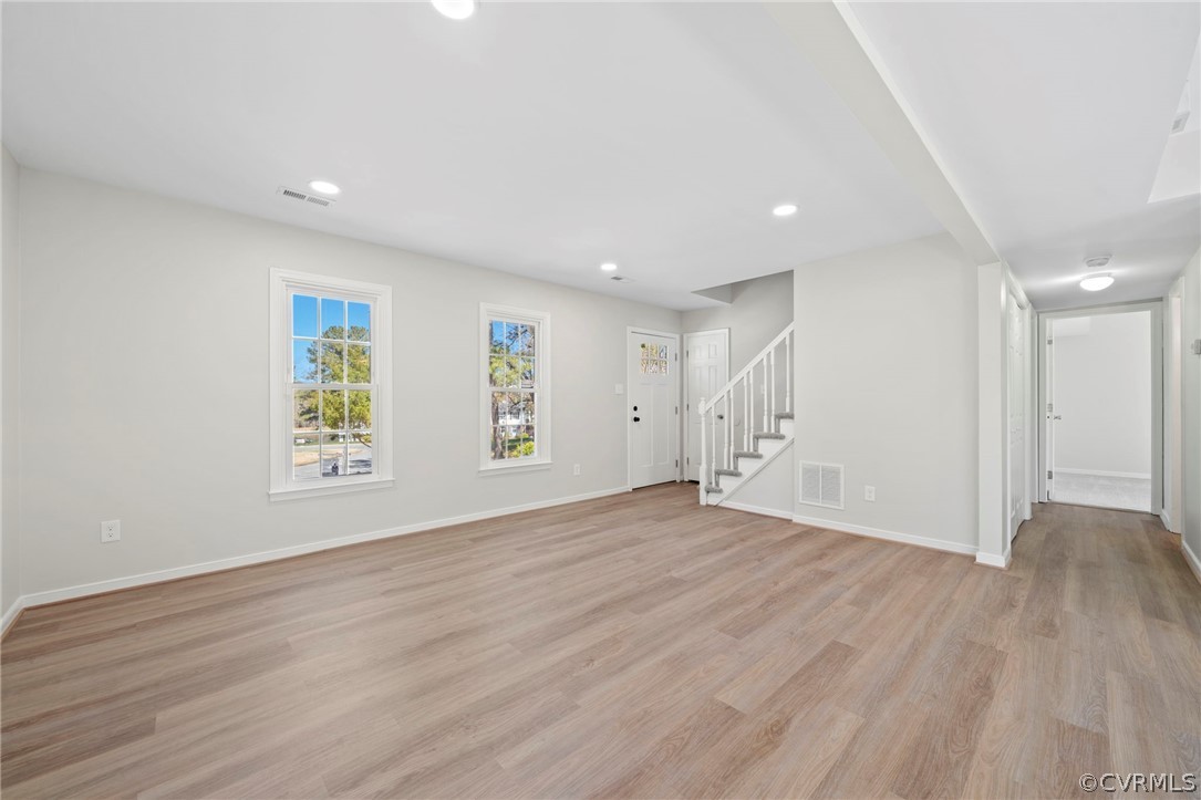 5205 Hallmark Circle Richmond, VA 23234 - Photo 5 of 36 a view of an empty room with wooden floor and a window