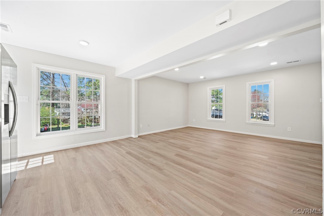 5205 Hallmark Circle Richmond, VA 23234 - Photo 10 of 36 a view of an empty room with wooden floor and a window