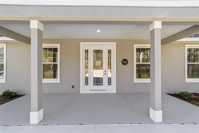 a view of a house with a door and a window