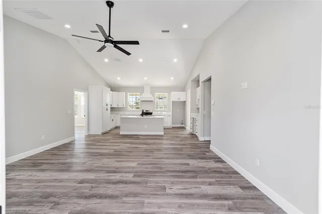 a view of a kitchen with a sink and microwave