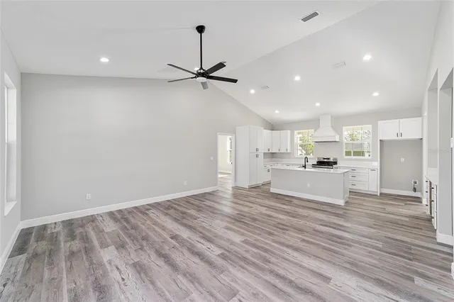 a view of kitchen with wooden floor and window