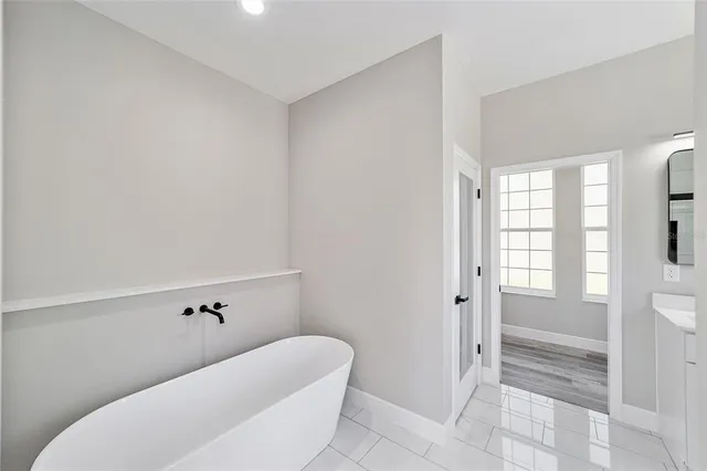 a bathroom with a bathtub and shower
