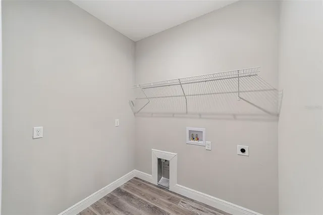 a view of a living room and floor to ceiling window