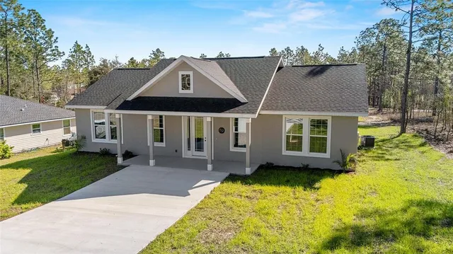 an aerial view of a house with swimming pool