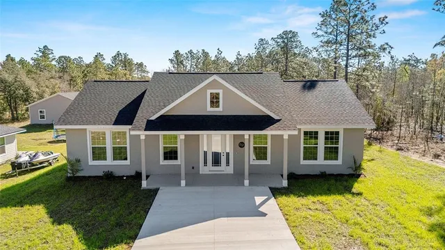 an aerial view of residential house with outdoor space