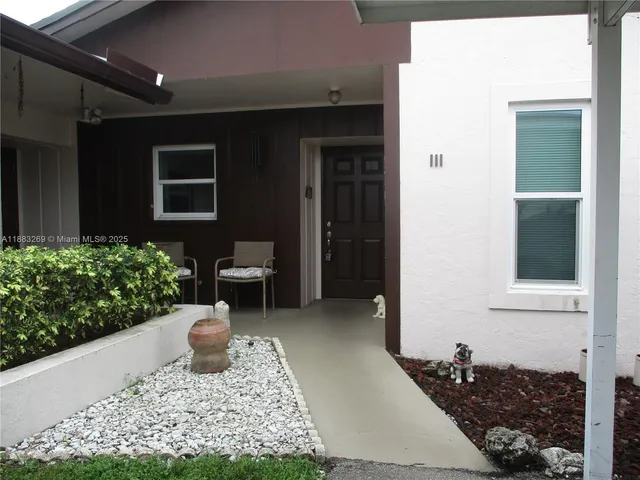 a house with yard in front of it