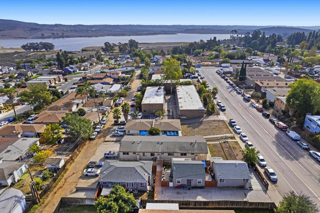 an aerial view of residential houses with outdoor space
