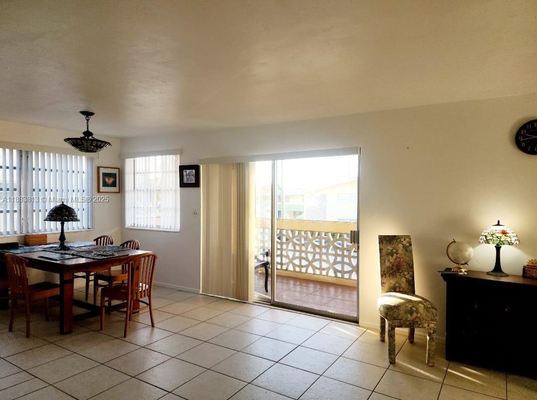 11960 Northeast 19th Drive, Unit 10 North Miami, FL 33181 - Photo 20 of 40 a view of a workspace with furniture and a window