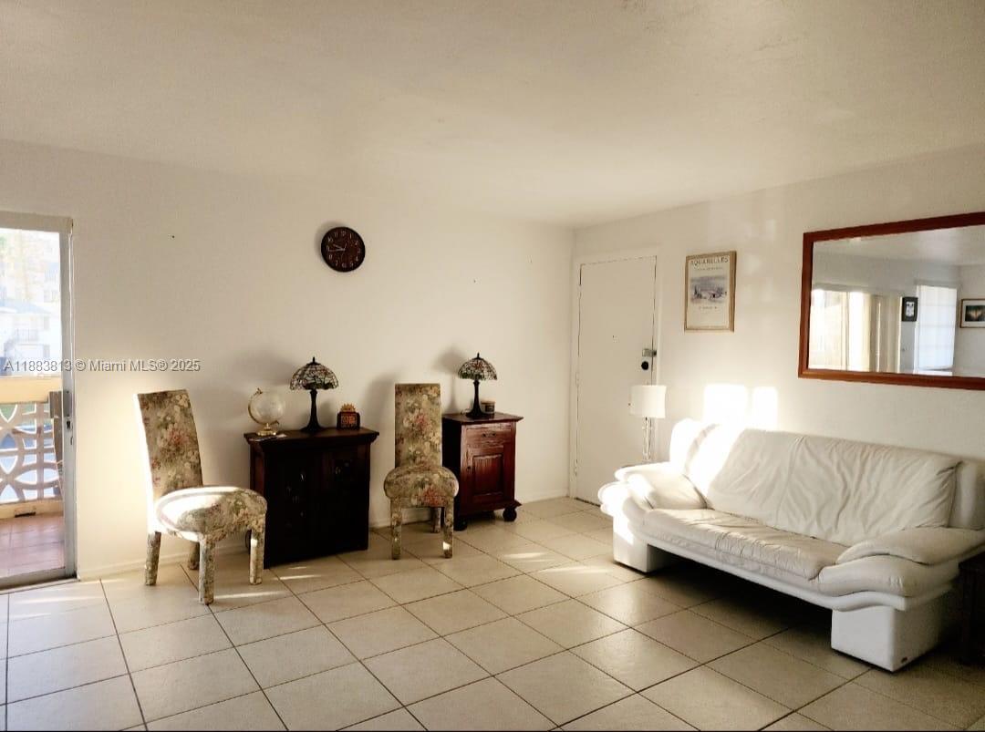 11960 Northeast 19th Drive, Unit 10 North Miami, FL 33181 - Photo 24 of 40 a living room with furniture and a couch
