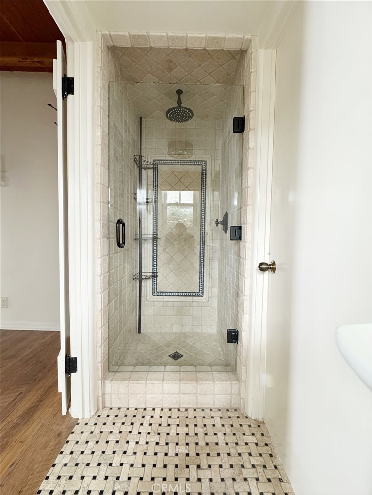 1211 West Bay Avenue Newport Beach, CA 92661 - Photo 12 of 29 a bathroom with a glass door shower