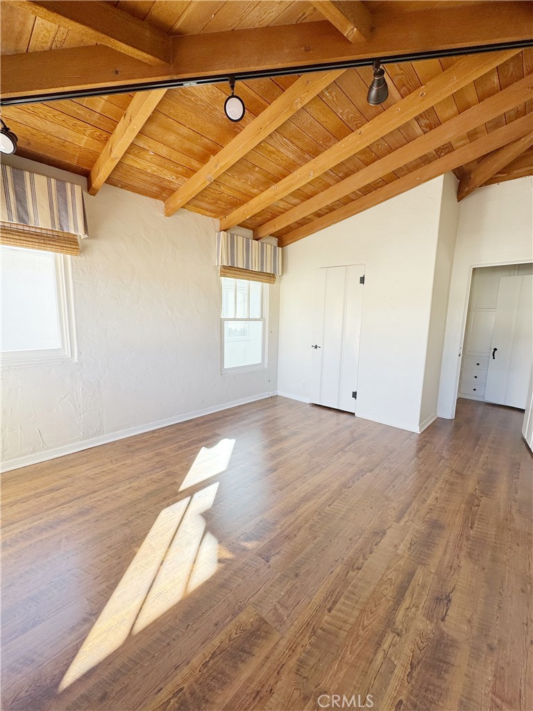 1211 West Bay Avenue Newport Beach, CA 92661 - Photo 18 of 29 a view of a room with wooden floor and windows