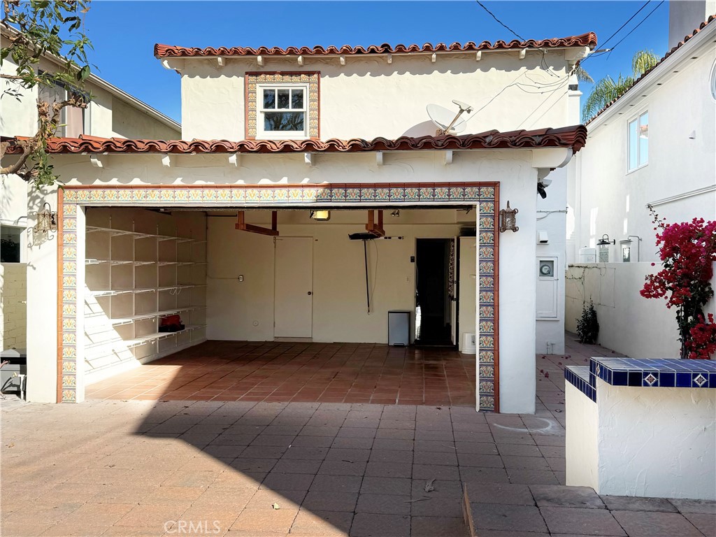 1211 West Bay Avenue Newport Beach, CA 92661 - Photo 21 of 29 a view of a house with a balcony and a couch