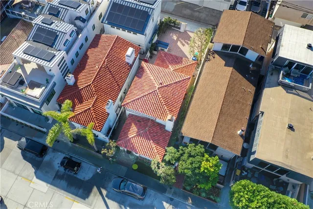 an aerial view of a house with a ocean view