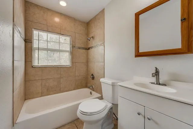 a bathroom with a sink a toilet and a bathtub