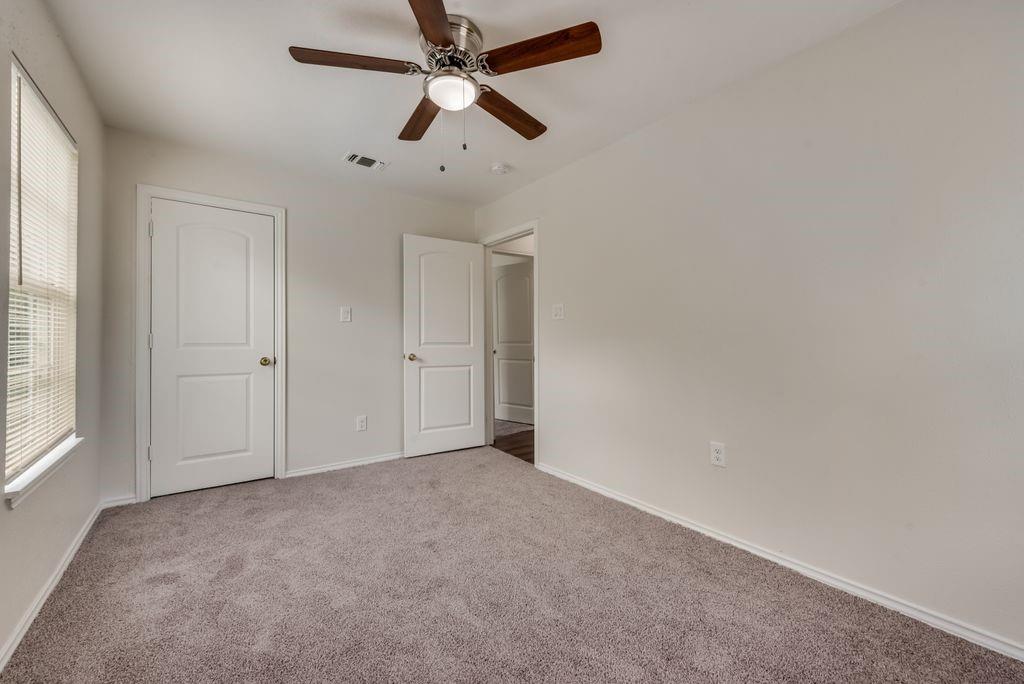 3005 Hatcher Street Fort Worth, TX 76105 - Photo 13 of 19 an empty room with chandelier fan