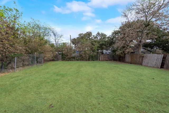 a view of a backyard with a trampoline