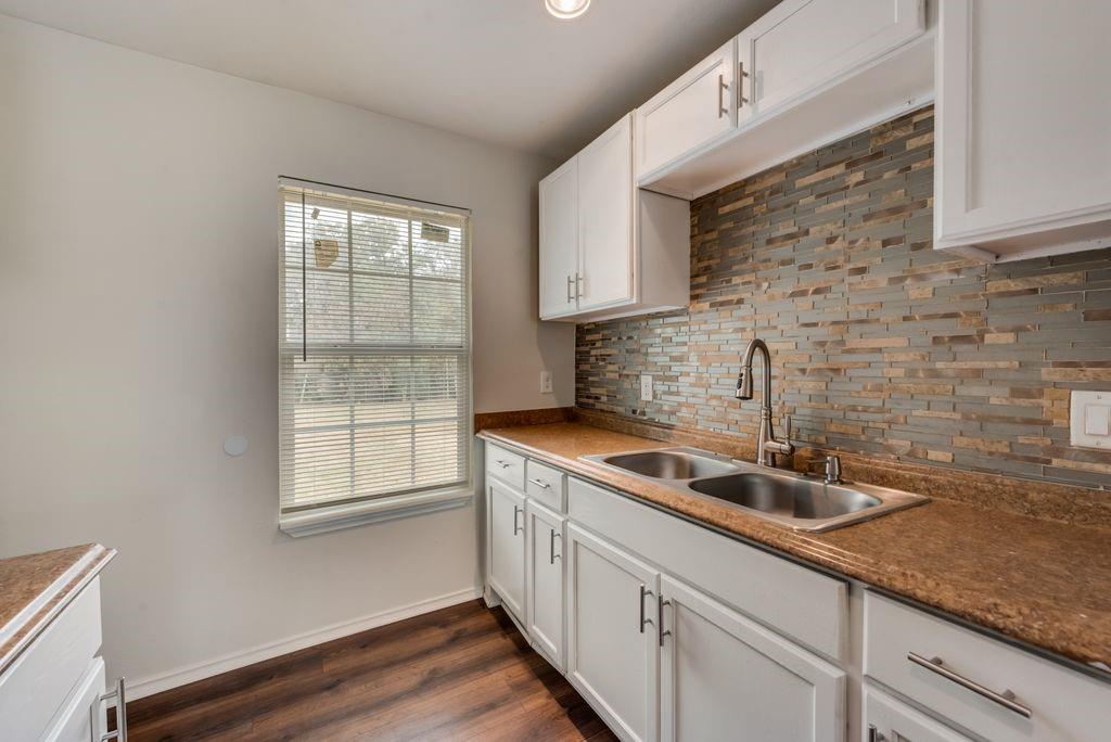3005 Hatcher Street Fort Worth, TX 76105 - Photo 8 of 19 a kitchen with a sink and cabinets
