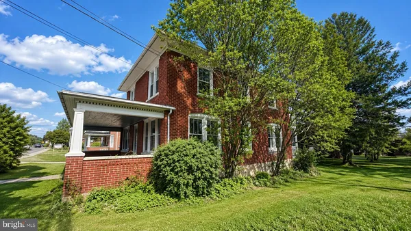 a view of a house with a tree