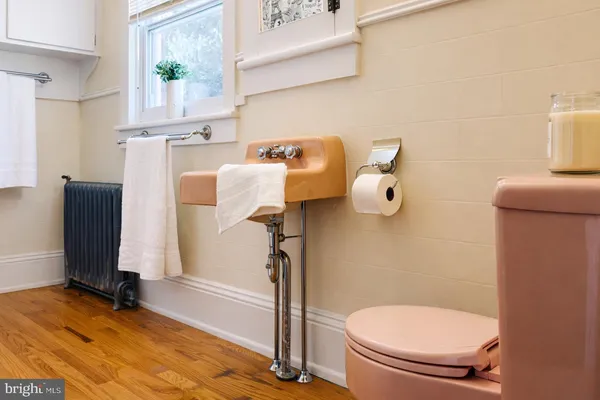 a bathroom with a toilet and a sink