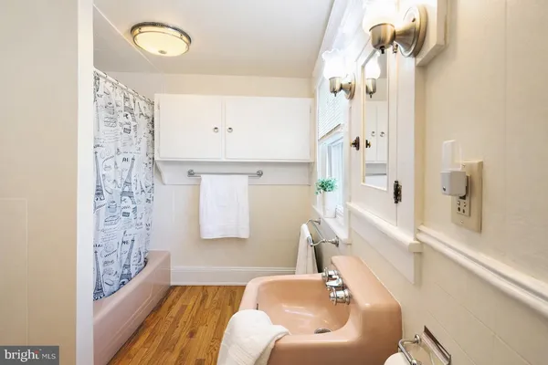 a bathroom with a bathtub and shower