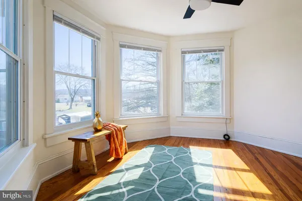 a spacious bedroom with a bed and a window