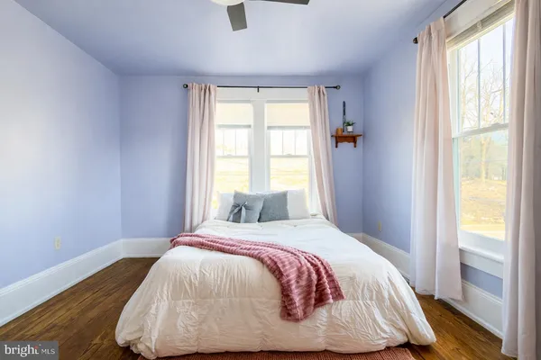 a bedroom with a bed and window