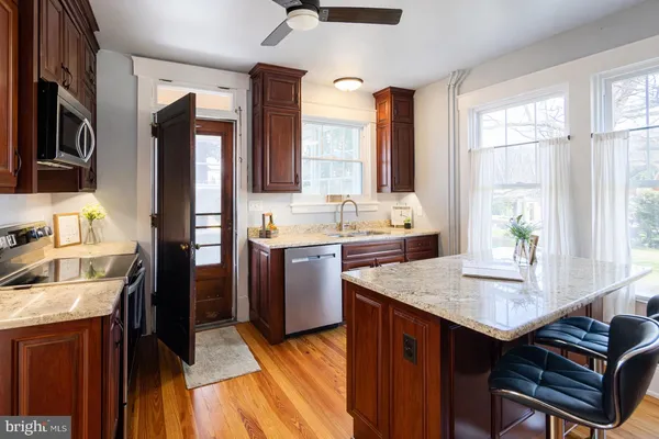 a kitchen with a stove a sink and a refrigerator