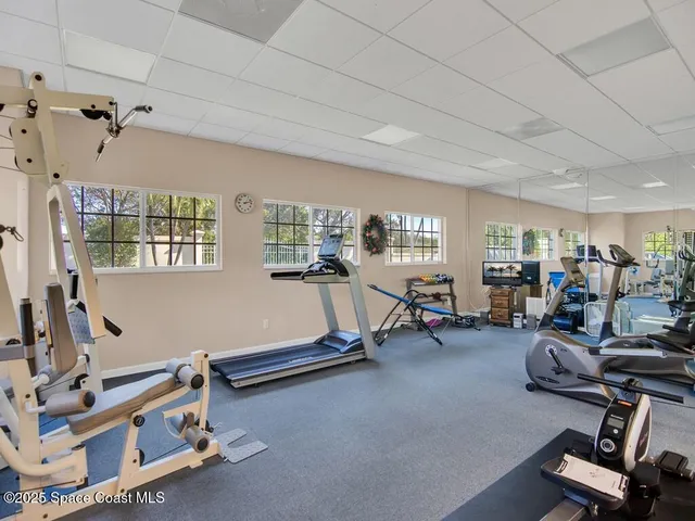 a room with gym equipment and a window