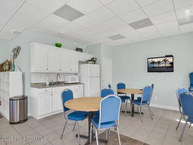 a view of kitchen with cabinets and wooden floor