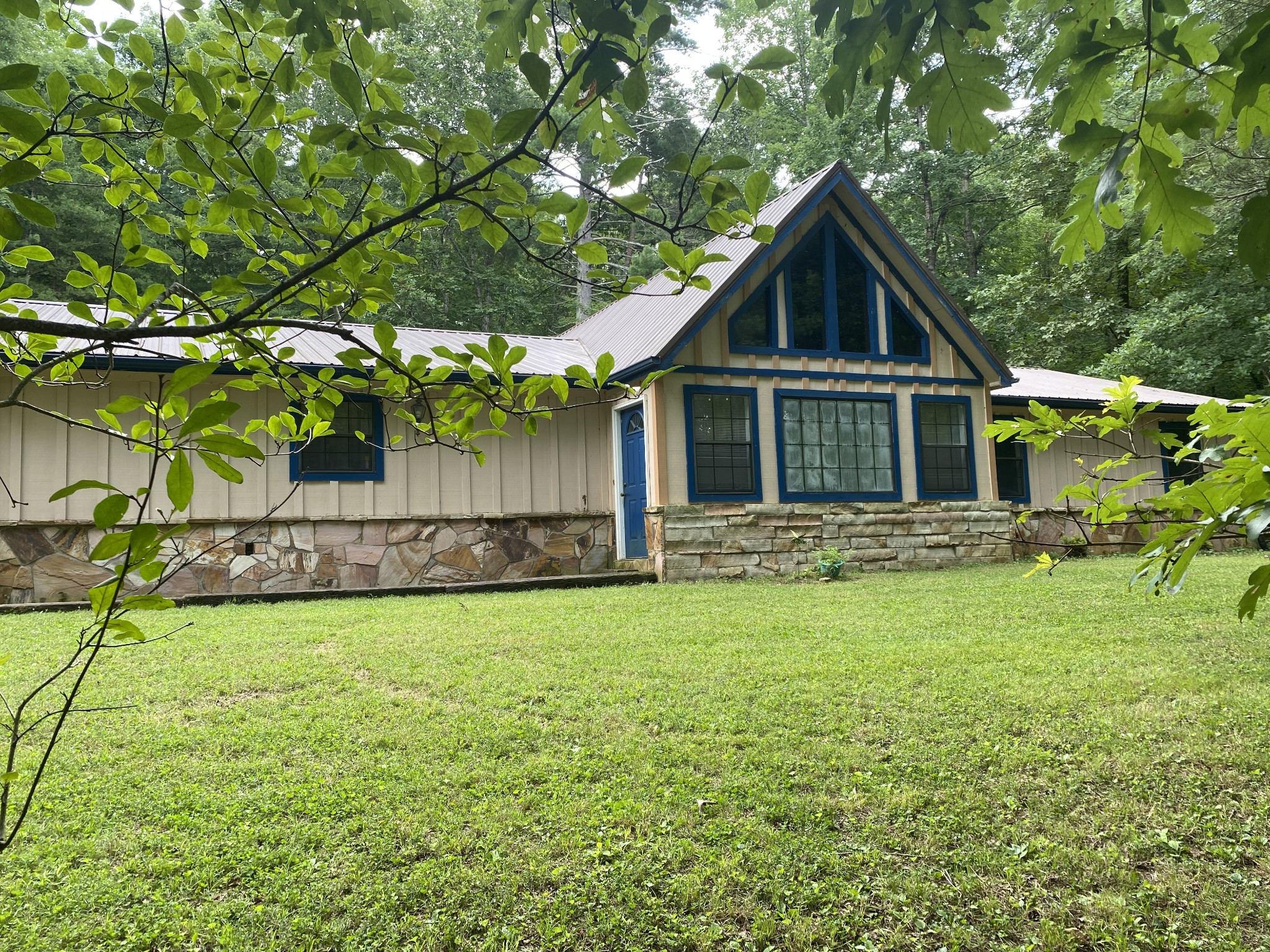 1480 Torbett Road Spring City, TN 37381 - Photo 1 of 1 a front view of a house with a yard and garage