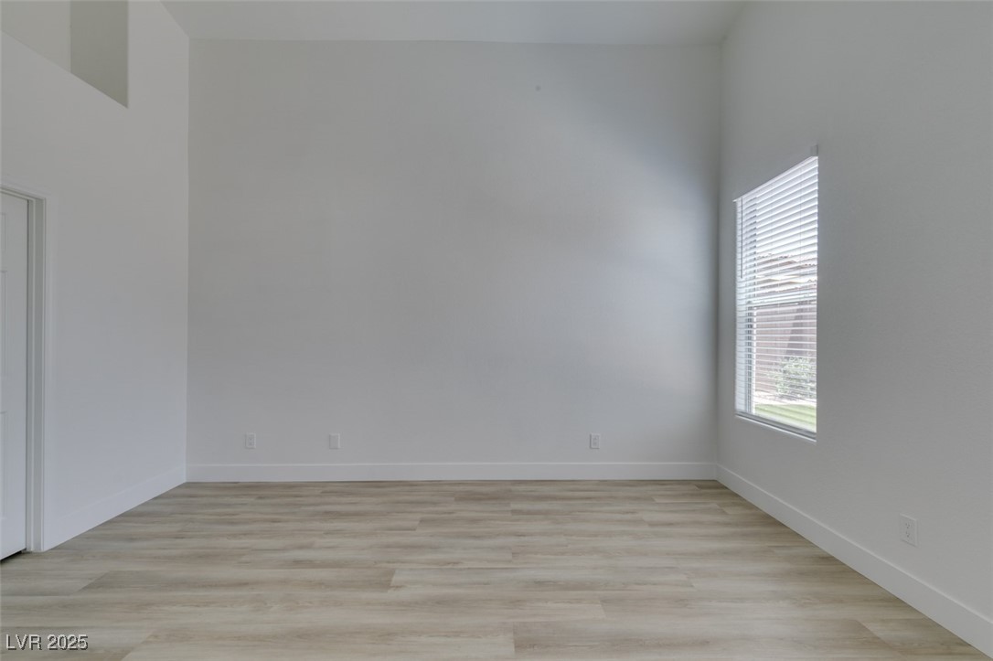 823 Wintersweet Road Henderson, NV 89015 - Photo 39 of 50 Spare room with light wood finished floors and baseboards