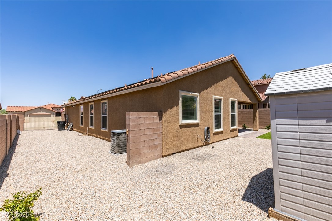 823 Wintersweet Road Henderson, NV 89015 - Photo 48 of 50 Back of house with stucco siding and a fenced backyard