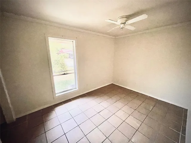 a view of an empty room and a window