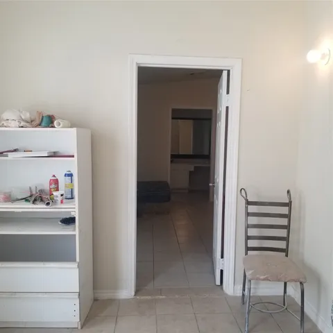 a room with walk in closet and window