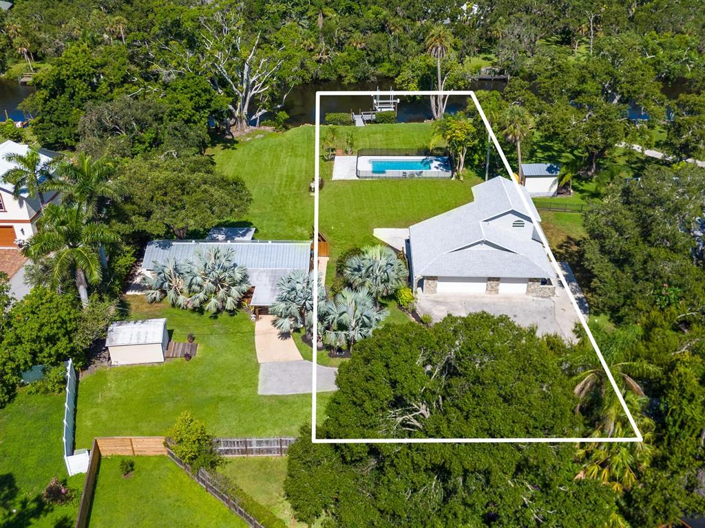 2504 Wilkinson Road Sarasota, FL 34231 - Photo 5 of 12 an aerial view of house with a swimming pool