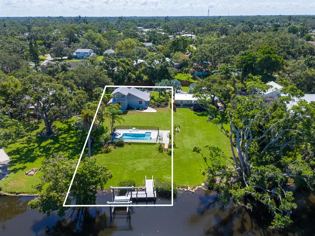 2504 Wilkinson Road Sarasota, FL 34231 - Photo 7 of 12 an aerial view of a houses with a yard