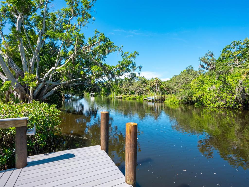 2504 Wilkinson Road Sarasota, FL 34231 - Photo 9 of 12 a wooden pier with boats in a lake