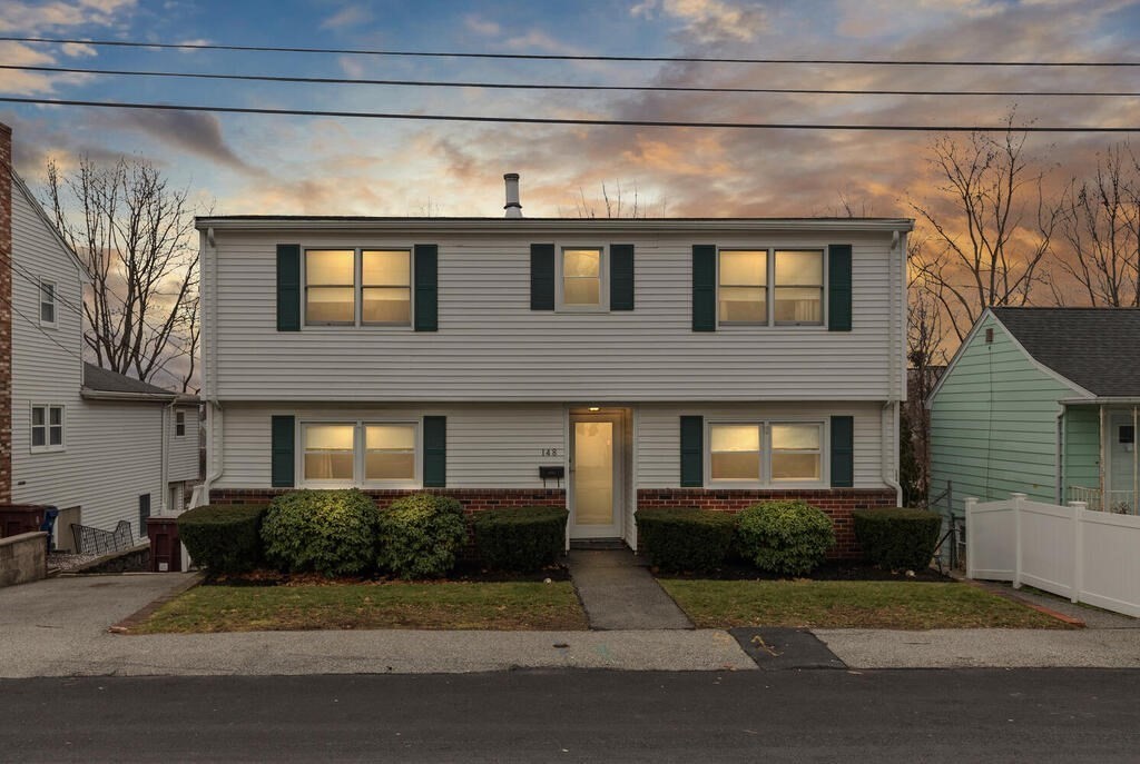148 Ridge Road Revere, MA 02151 - Photo 1 of 31 a front view of a house with a yard