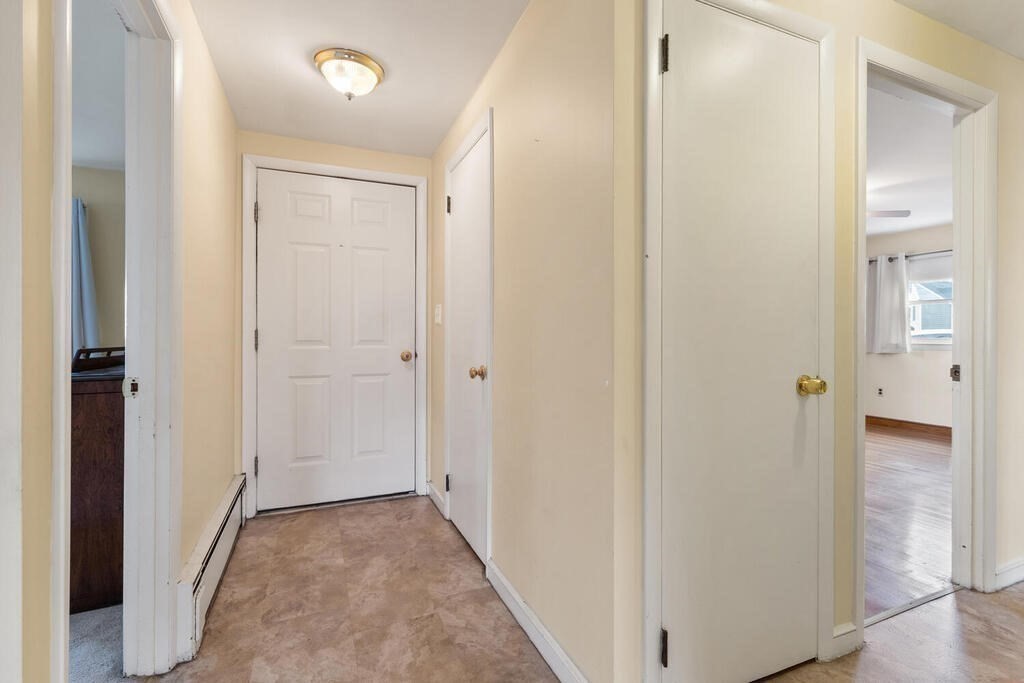 148 Ridge Road Revere, MA 02151 - Photo 14 of 31 a view of a hallway with wooden floor