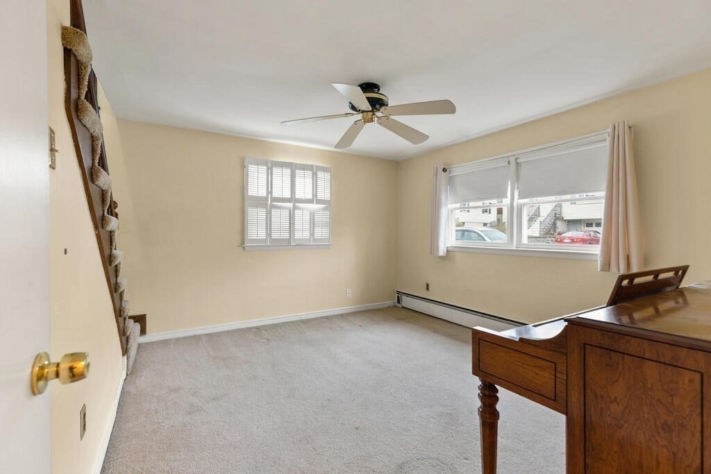 148 Ridge Road Revere, MA 02151 - Photo 15 of 31 an empty room with windows and fan