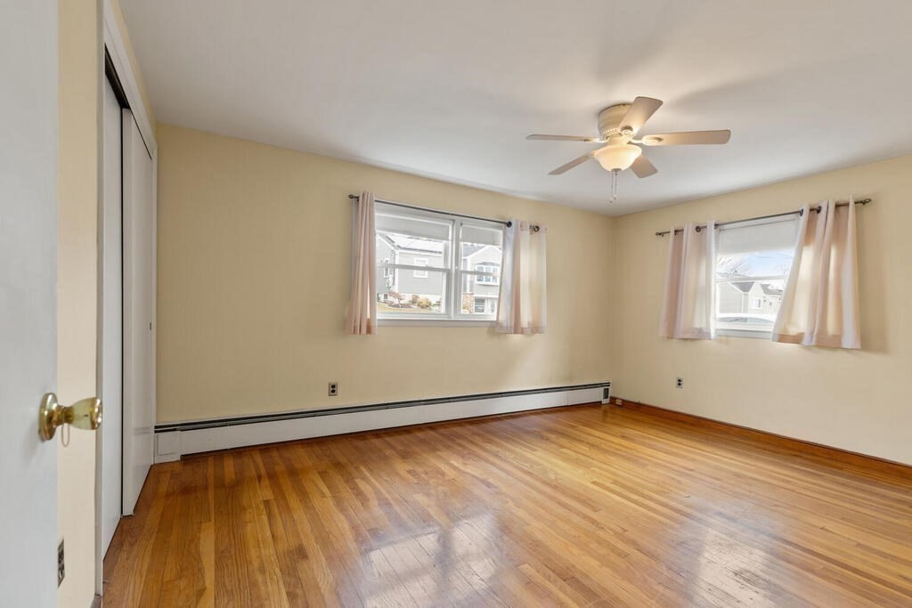 148 Ridge Road Revere, MA 02151 - Photo 17 of 31 a view of empty room with wooden floor and fan