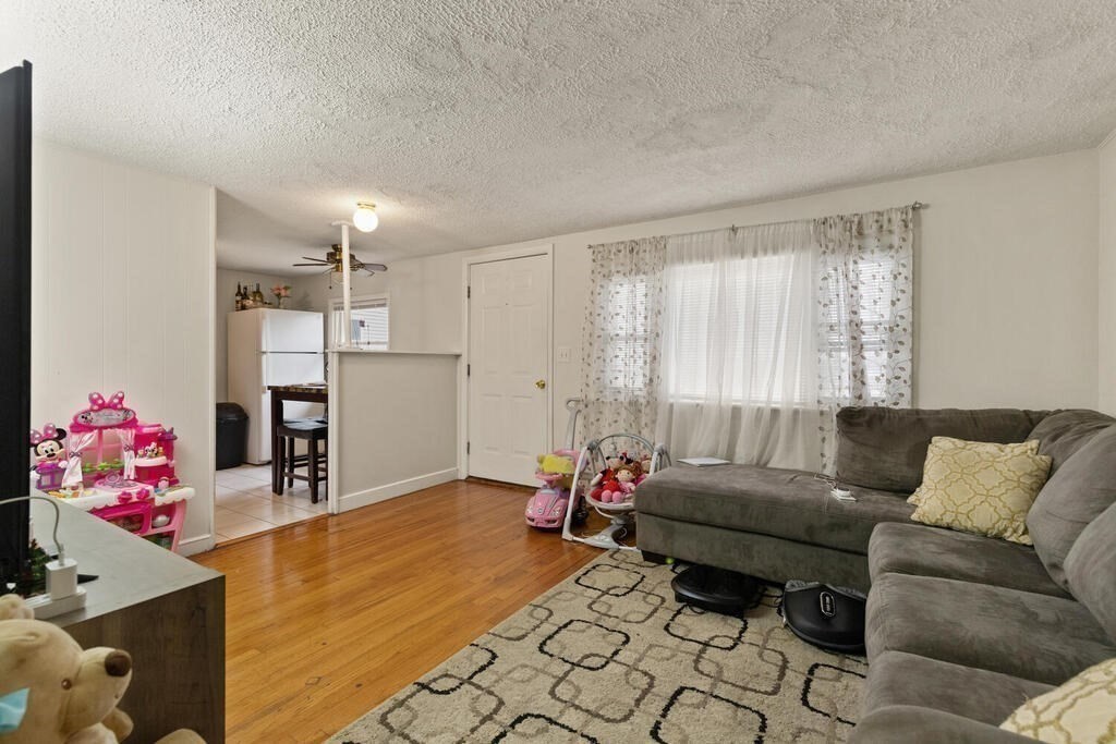 148 Ridge Road Revere, MA 02151 - Photo 26 of 31 a living room with furniture and flowers