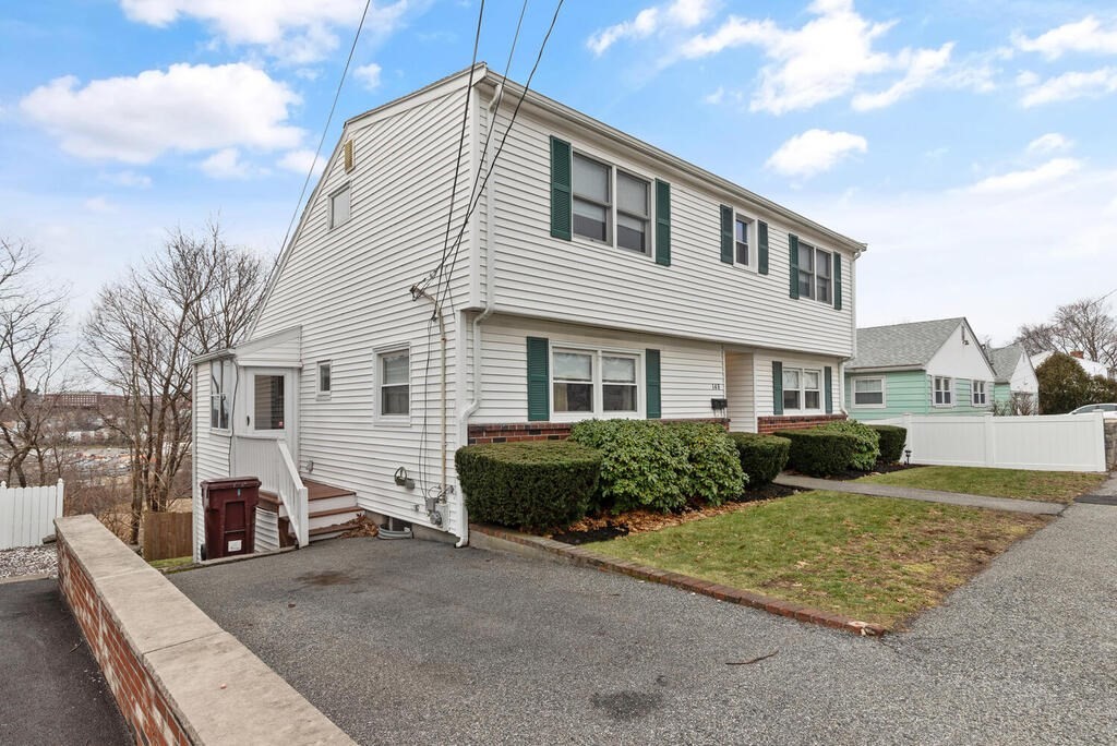 148 Ridge Road Revere, MA 02151 - Photo 3 of 31 a front view of a house with a yard