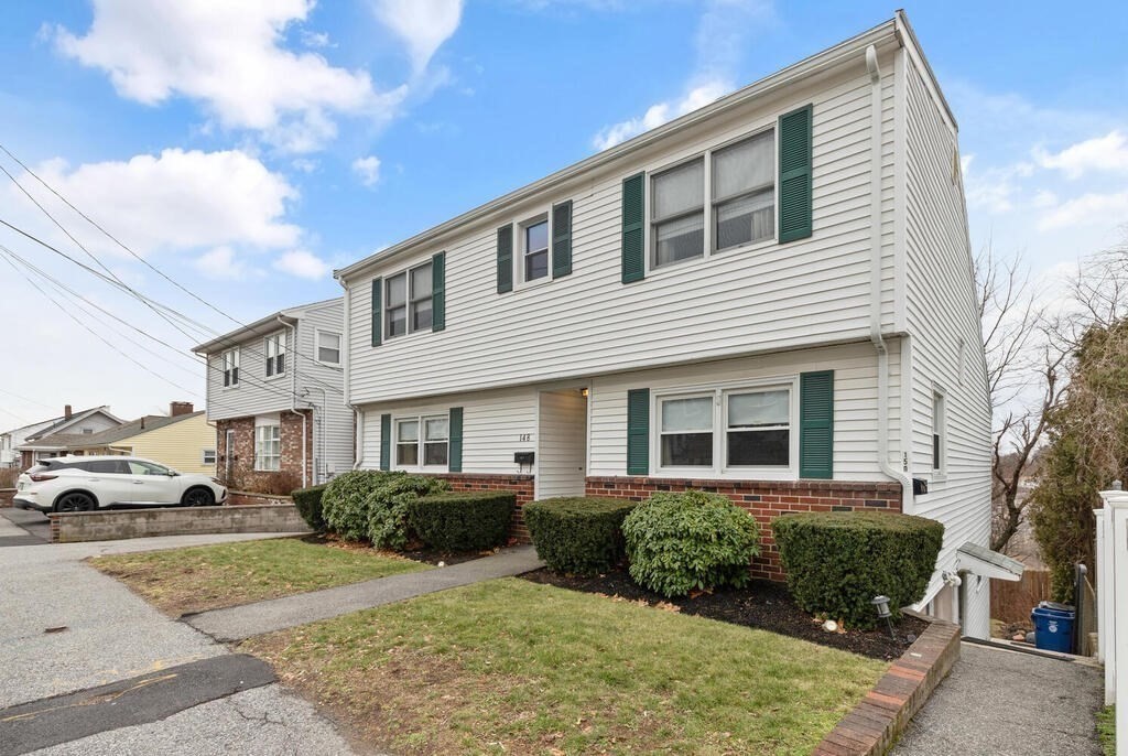 148 Ridge Road Revere, MA 02151 - Photo 4 of 31 a front view of a house with a yard