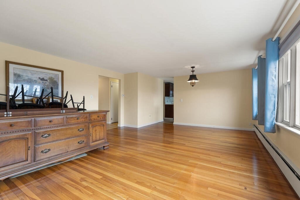 148 Ridge Road Revere, MA 02151 - Photo 8 of 31 a view of a livingroom with wooden floor cabinet and window