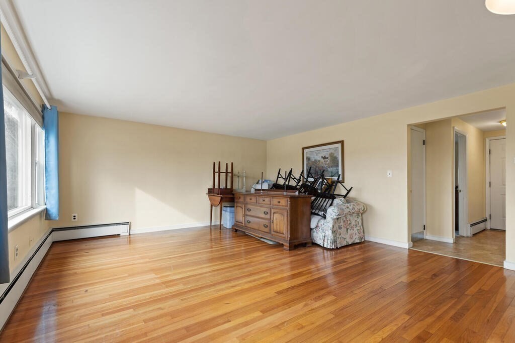148 Ridge Road Revere, MA 02151 - Photo 9 of 31 a view of a living room kitchen and a wooden floor