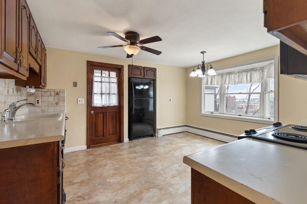 148 Ridge Road Revere, MA 02151 - Photo 10 of 31 a view of a livingroom with a kitchen and a window